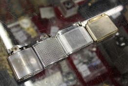 Four Ronson lighters.