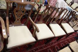 A George III style mahogany armchair and three similar single chairs.