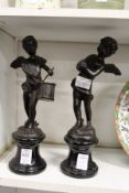 After Auguste Moreau, a pair of angels playing drums and cymbals on marble bases.