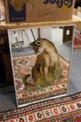 A mirror decorated with a lioness.