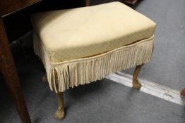 A gilt framed dressing table stool.