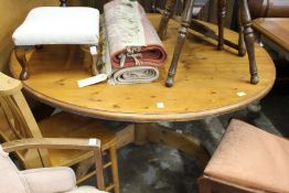 A modern pine circular table.