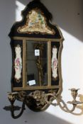 A pair of decorative continental style porcelain and ormolu mirror back wall girandoles.
