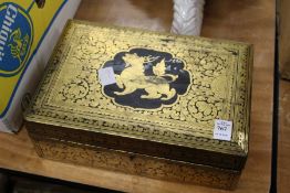 An Indonesian gilt decorated lacquer box.