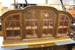 An oak display cabinet.