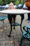 A Victorian pub style circular cast iron table.