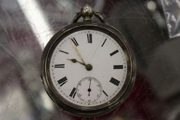 A silver pocket watch.