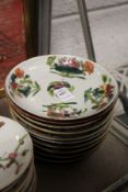 Ten Chinese floral decorated saucer dishes.