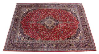 A good large Kashan carpet, claret ground with all-over floral decoration.