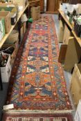 A good Persian runner / hall carpet, blue ground with stylized decoration.