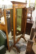 A good oak cheval mirror with folding side mirrors.
