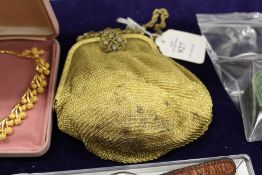 A gilt metal mesh style evening bag and a small group of bijouterie.