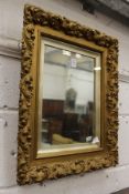 A decorative small gilt framed mirror.