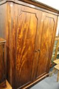 A Victorian mahogany two door wardrobe.