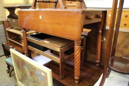 A mahogany Pembroke table.