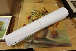 A small group of unframed posters.