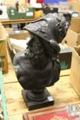 A cast metal classical male bust.