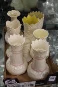 A collection of Belleek vases.