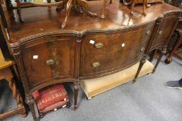 A mahogany serpentine fronted sideboard.