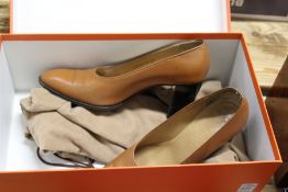 A pair of ladies' Hermes brown leather shoes, size 37, boxed.