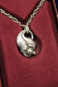 A Georg Jensen silver pendant and chain in original box.