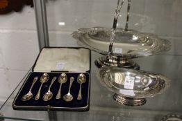 A small silver pedestal dish, a cased set of six silver coffee spoons and a plated cake basket.