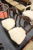 A pair of Victorian dining chairs.