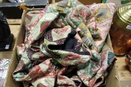 An embroidered bed throw.