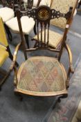 A good late Victorian inlaid mahogany open armchair.