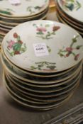 Ten small Chinese floral decorated saucers.