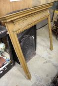 Decorative carved pine fire surround.
