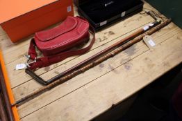 A dagger cane and a riding crop.