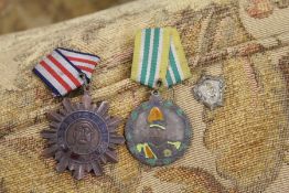 Two old Chinese medals and a French medal.