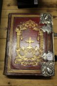 A 19th century gilt tooled leather-bound Bible with silver mounts.