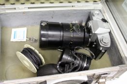 A Leicaflex 35mm camera with two lenses and an aluminium case.
