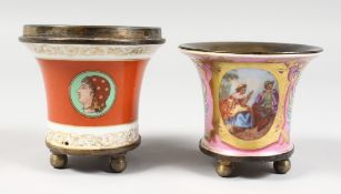 Two miniature continental porcelain and ormolu jardinieres on ball feet.