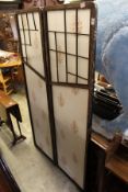 An oriental style folding dressing screen.