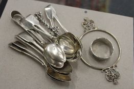 A quantity of silver teaspoons and other small items of silver ware to include pair of sugar nips