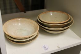 A group of seven early Chinese pottery bowls.
