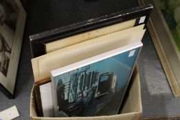 A photographic print of a lorry, two other prints and various frames.