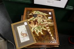 A porcelain plaque and small embroidered picture.