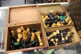 A quantity of chess pieces / sets in three boxes.