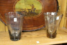 A pair of large glass vases.