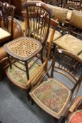An Edwardian inlaid mahogany occasional chair and two other chairs.