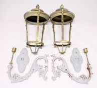 A good large pair of brass lanterns with ornate cast iron brackets.