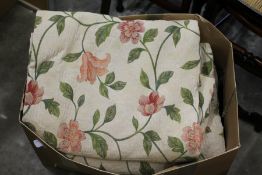 Floral curtains and bed throws.