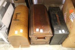 Two sewing machines and a table top gramophone.