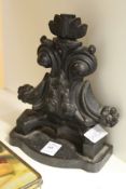 A cast iron door stop (AF).