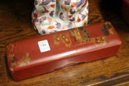 A Chinese red lacquer glove box.