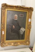 A portrait of an elderly gentleman seated in a chair oil on canvas in a decorative gilt frame.